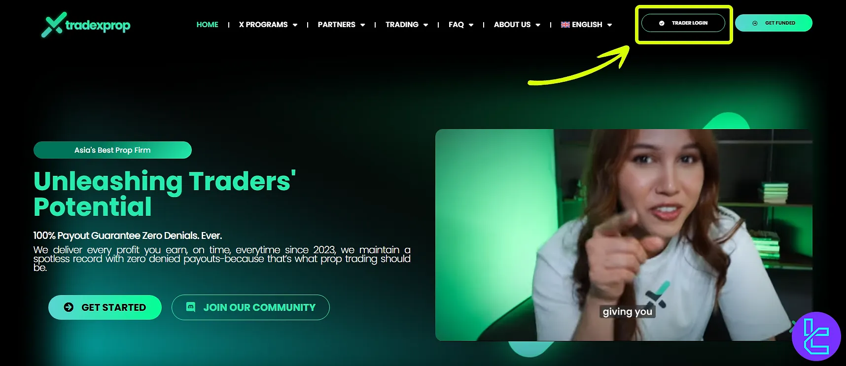 TradeXProp homepage showing the "Trader Login" button to start the sign-up process